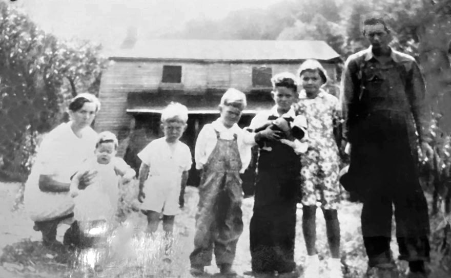 Rogers Family Photo in front of the farmhouse