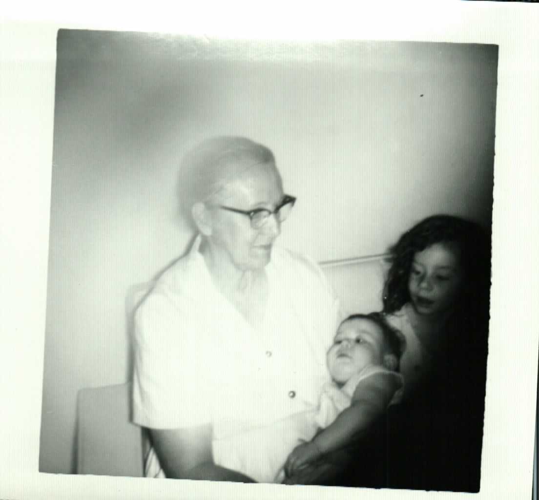 Hazel holding Rebecca with Mischelle