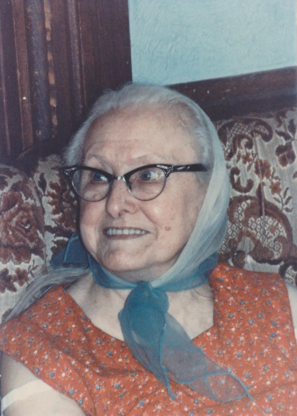 Hazel Rogers smiling with blue scarf