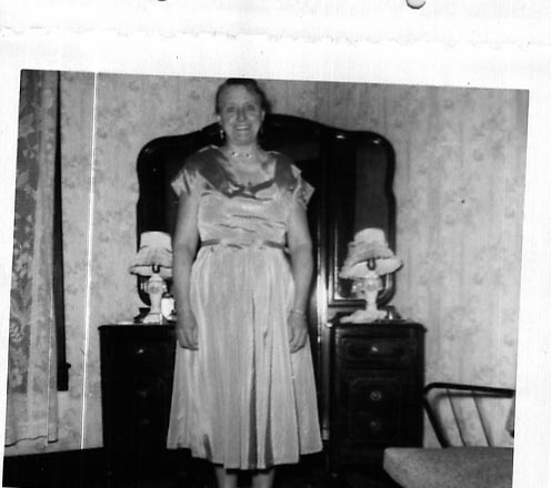 Hazel seated in dark room