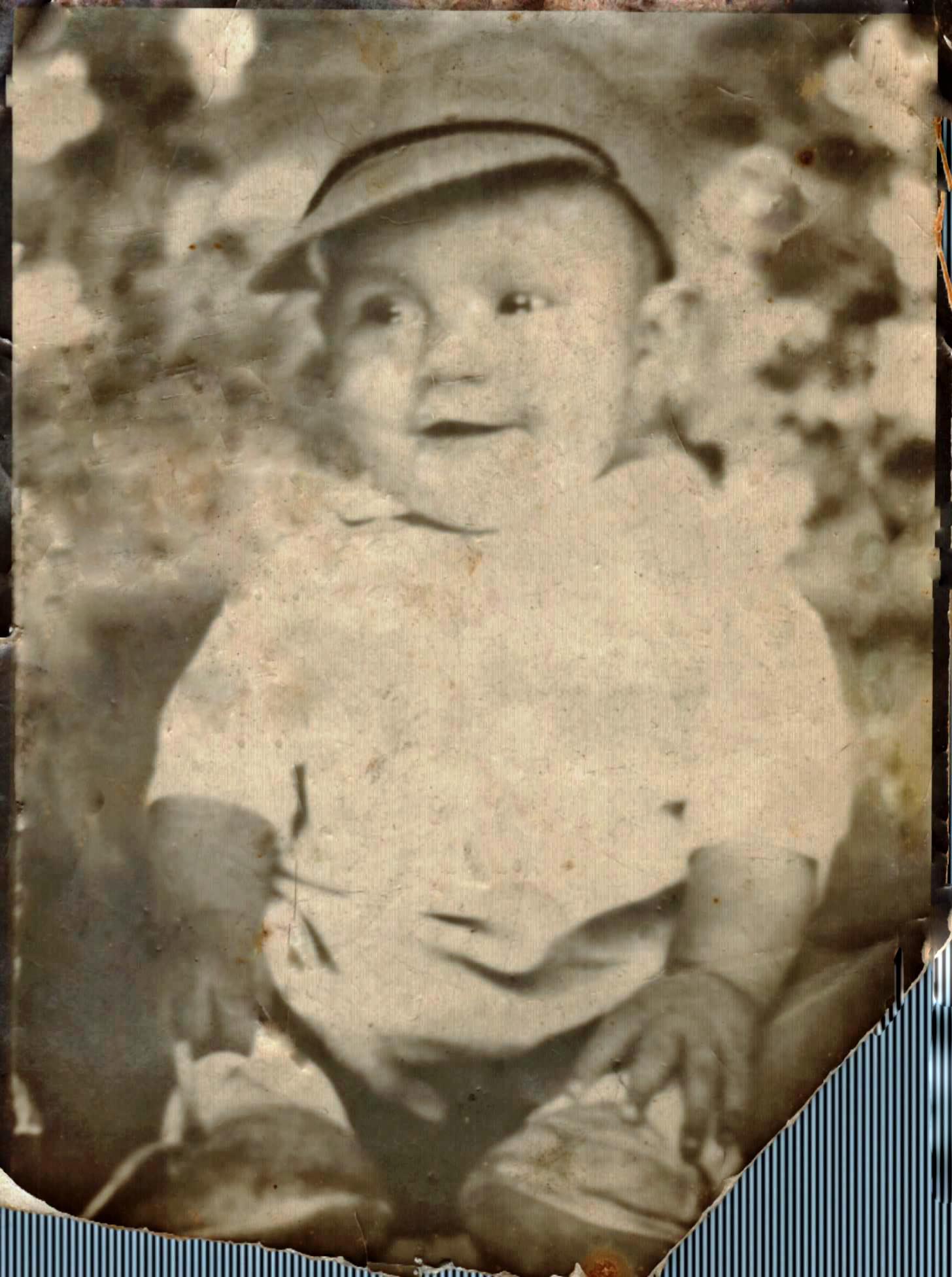 Gary Lee Doan smiling in baby cap