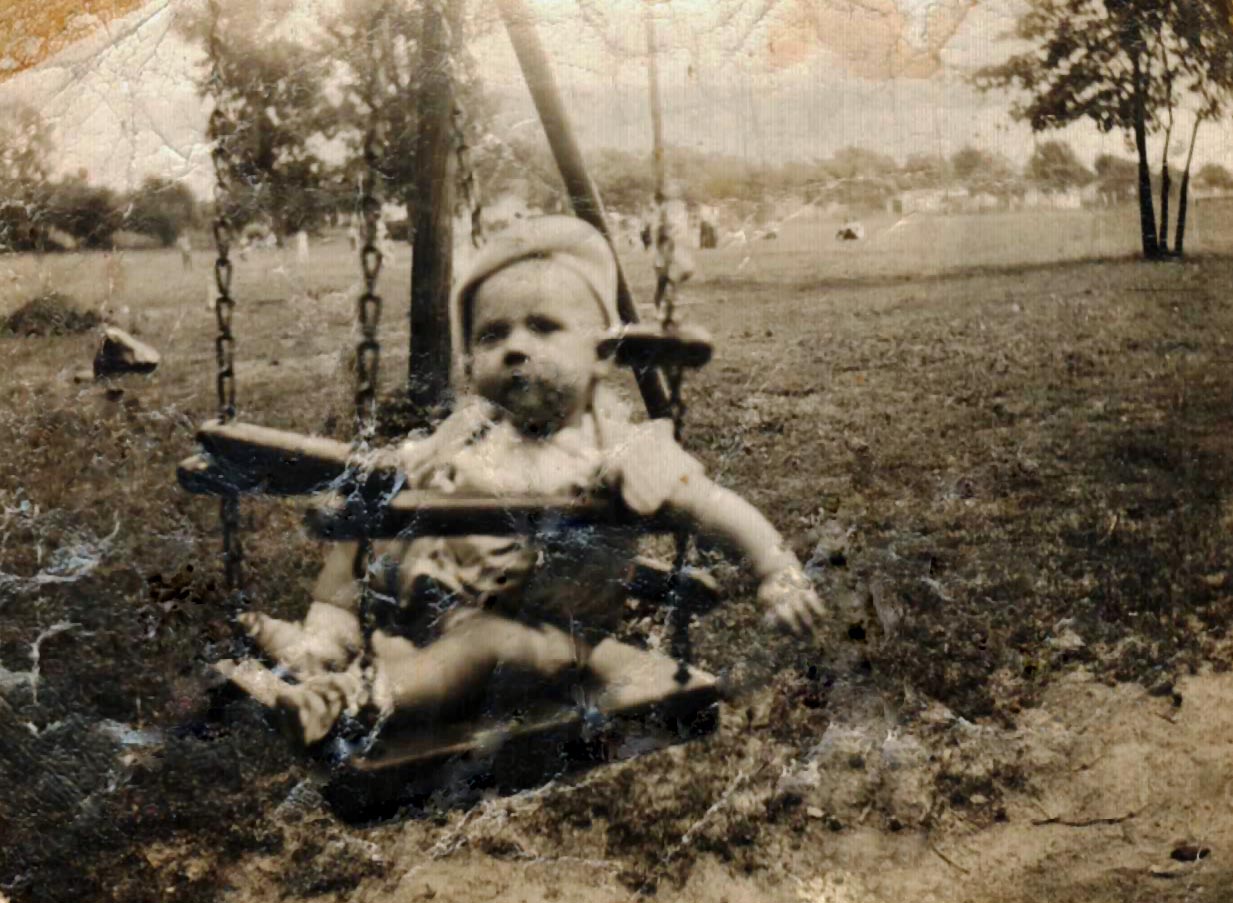 Gary Lee in a baby swing