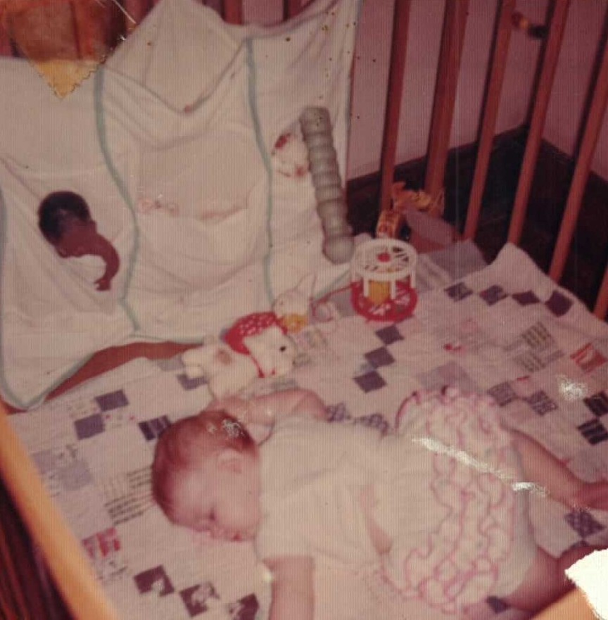 Katherine Lynn Rogers laying a quilt