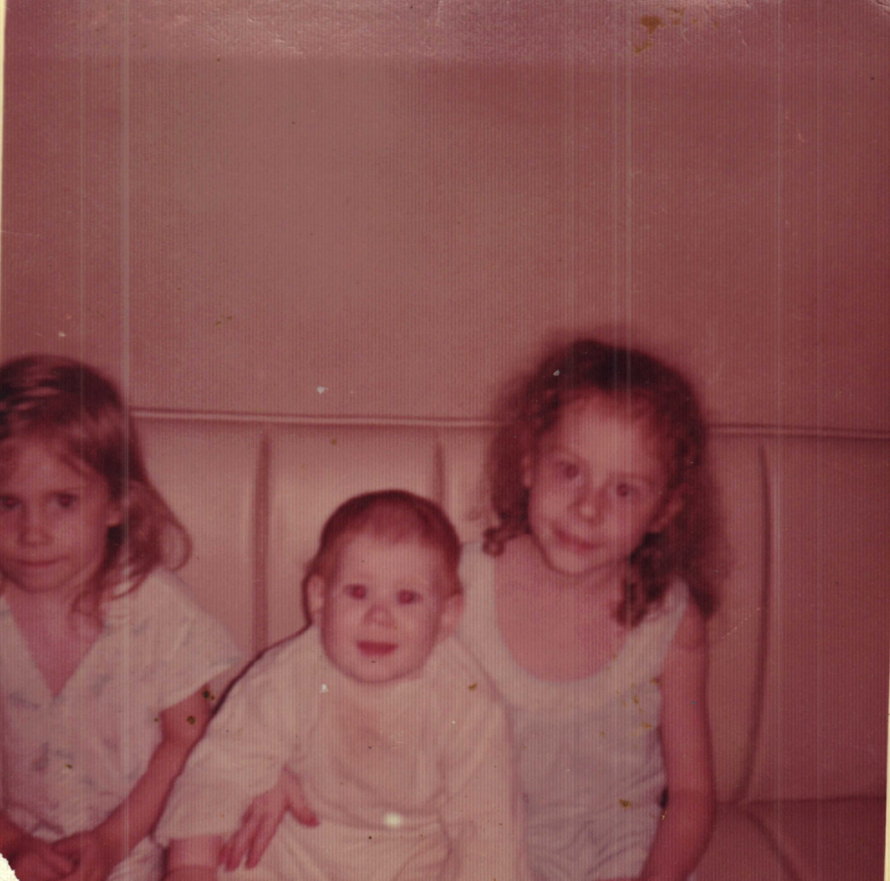 Rebecca, Katherine, and Mischelle Rogers on a chair